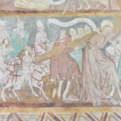 Šimon cyrenajský pomáha niesť Ježišovi kríž.